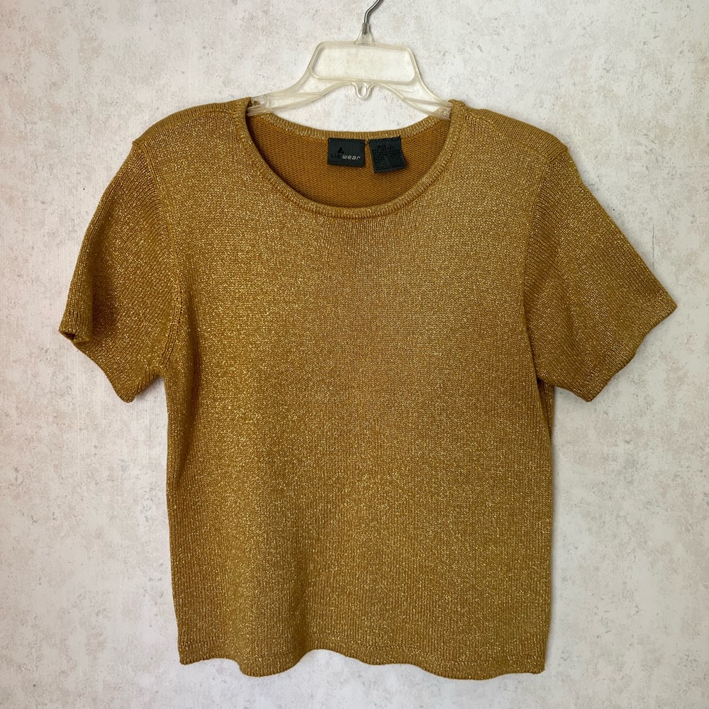 Shiny gold T-shirt.